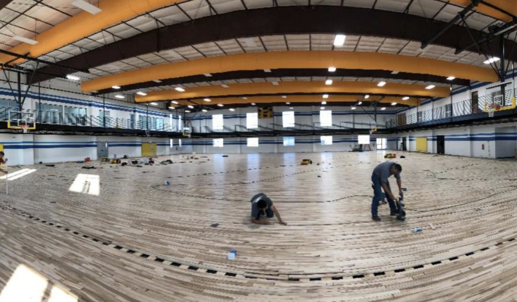 interior photo construction workers in a recreation center